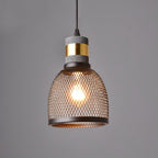 Industrial cement pendant light with bare filament bulb lit