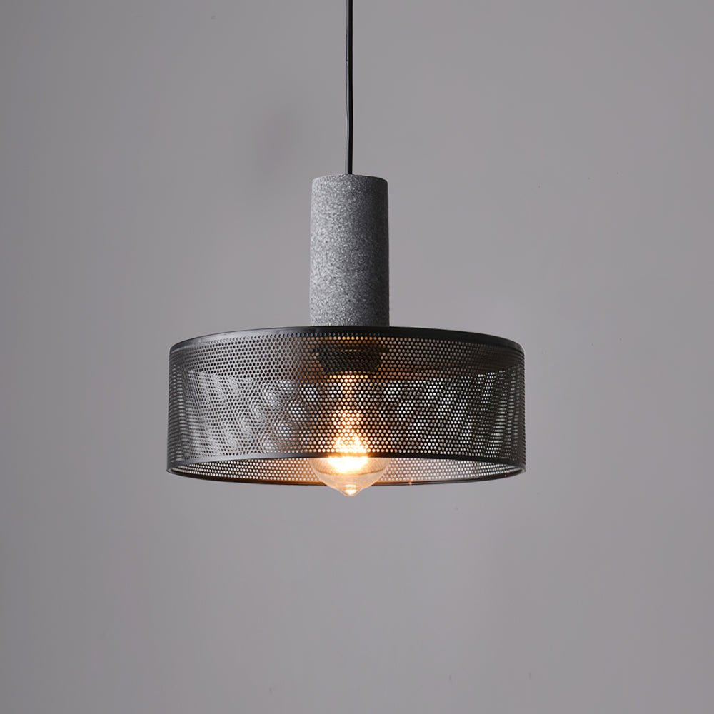 Cement mesh pendant light hanging in a loft-style interior