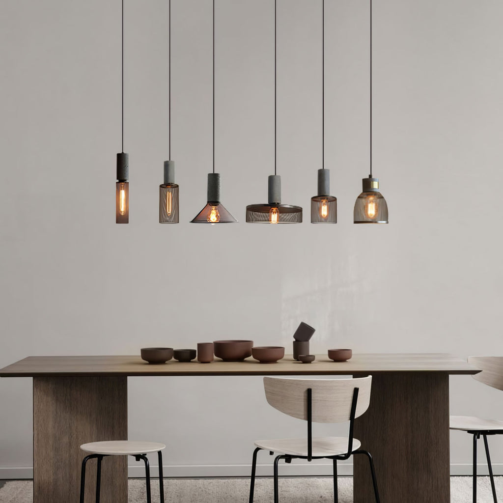 Wire cage pendant light projecting shadows across a ceiling