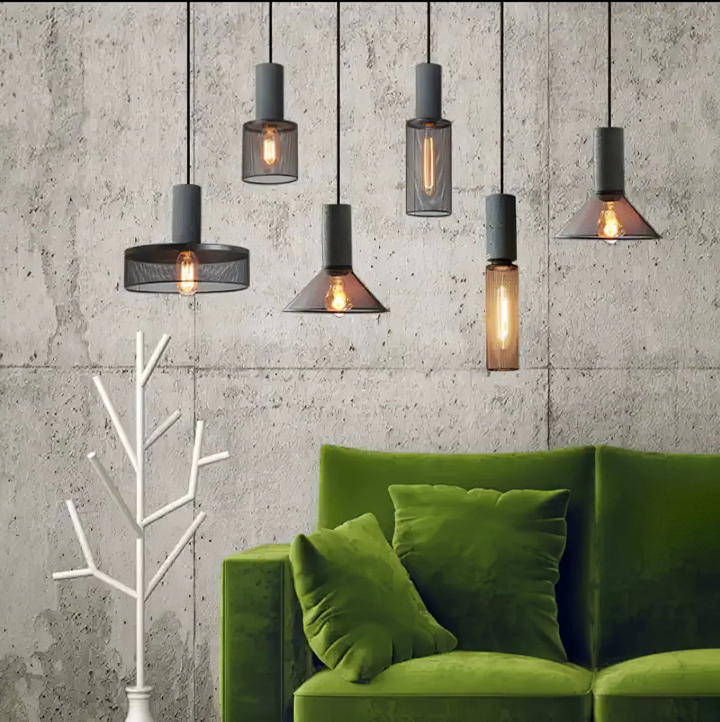 Cement-top pendant light with Edison bulb in an industrial kitchen