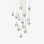 Ceramic flower pendant light glowing warmly in a styled interior