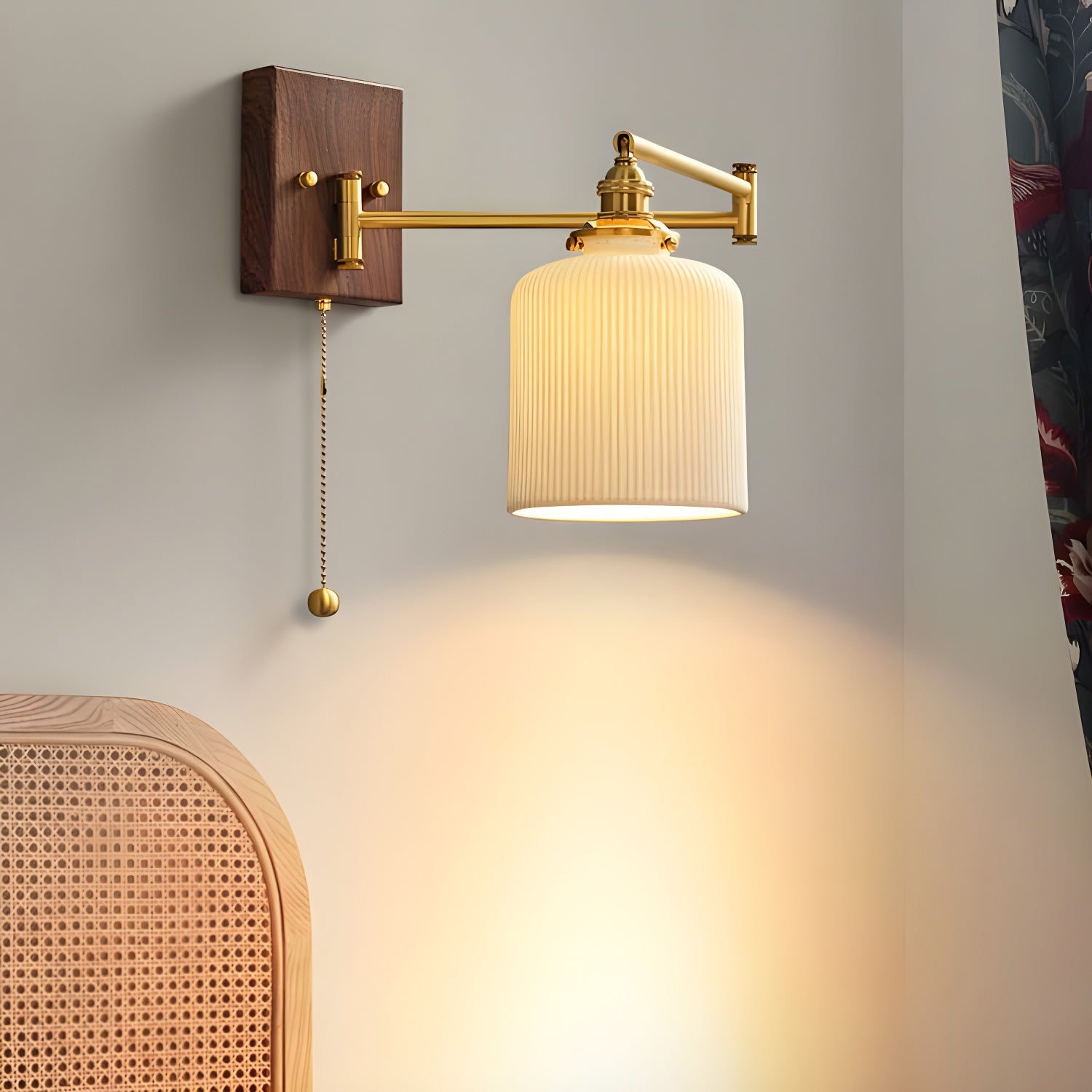 White ceramic wall lamp with walnut accent glowing beside a wall