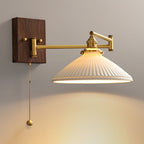 Ceramic wall lamp glowing through white glaze in a cosy interior