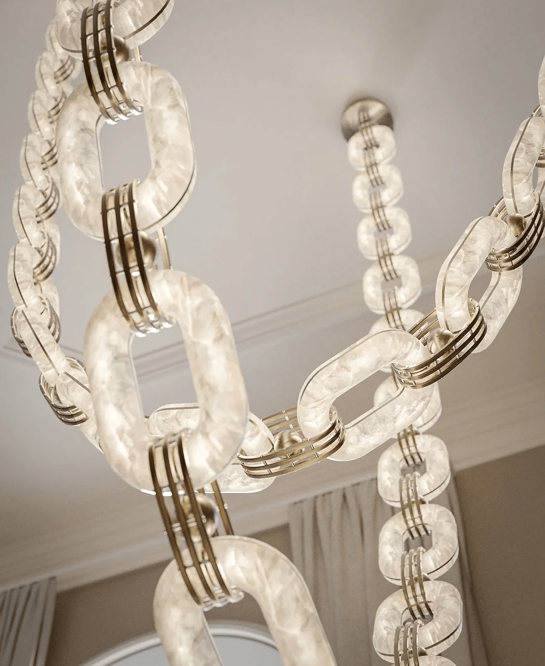 Tall view of the lit chain, its alabaster links bright and the brass collars catching the light