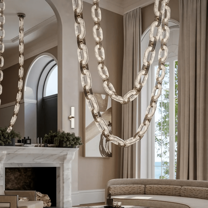 Close view of the chandelier's stone swags in front of long curtains and a marble mantel
