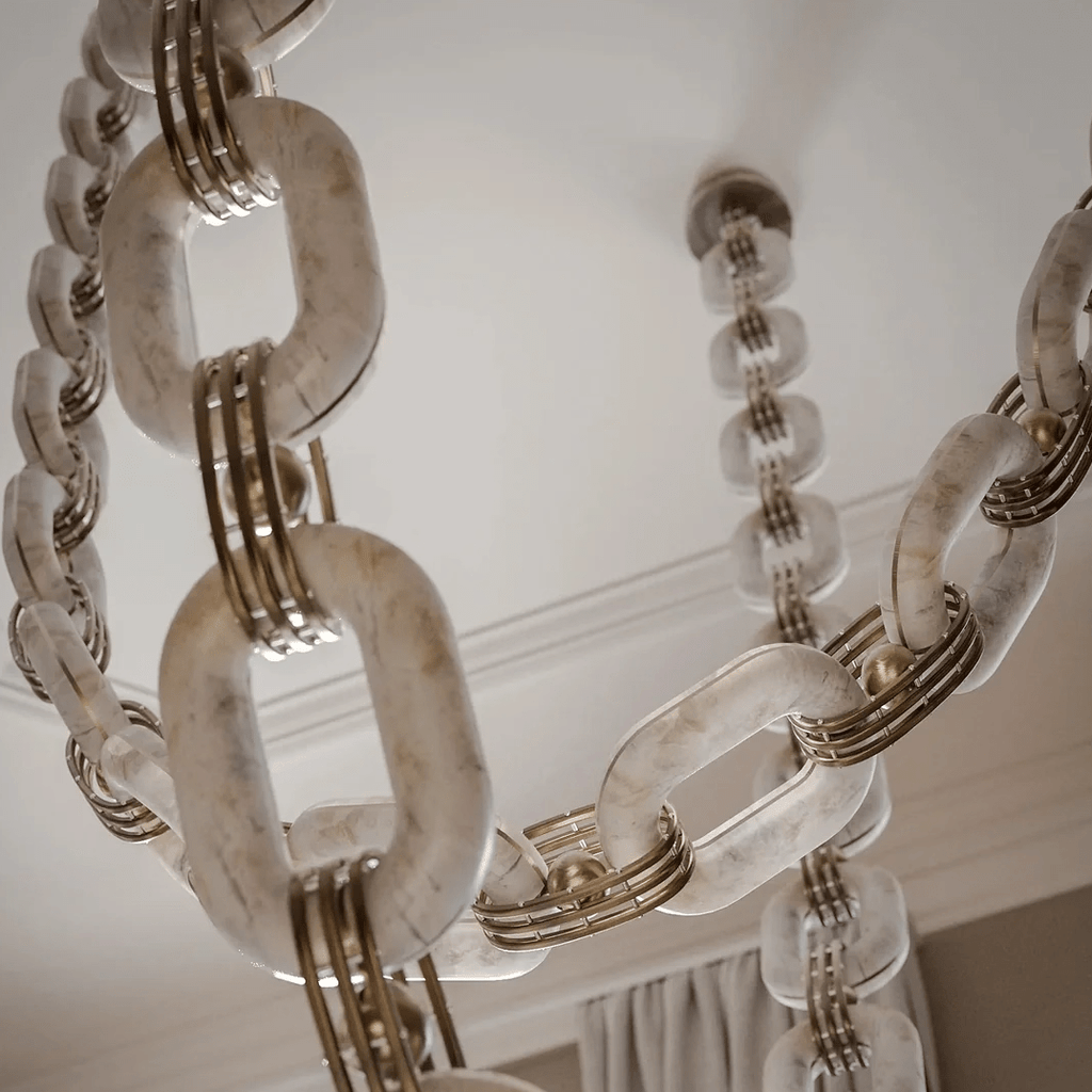 Looking up at the alabaster links and their brass banded collars, with the ceiling mount behind