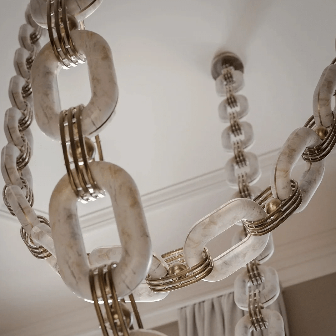 Looking up at the alabaster links and their brass banded collars, with the ceiling mount behind