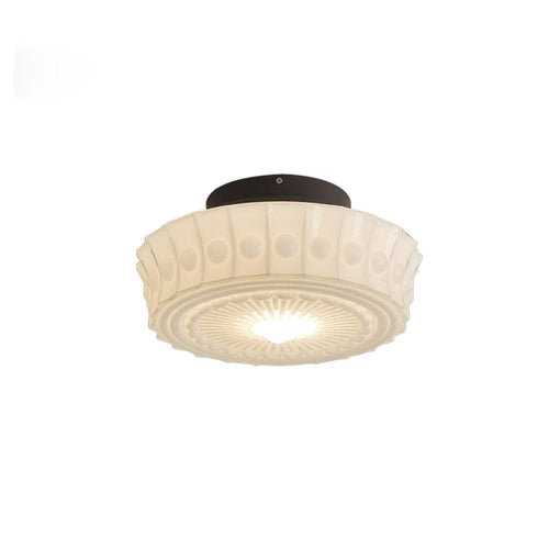 Black metal ceiling light with glass shades over an interior table