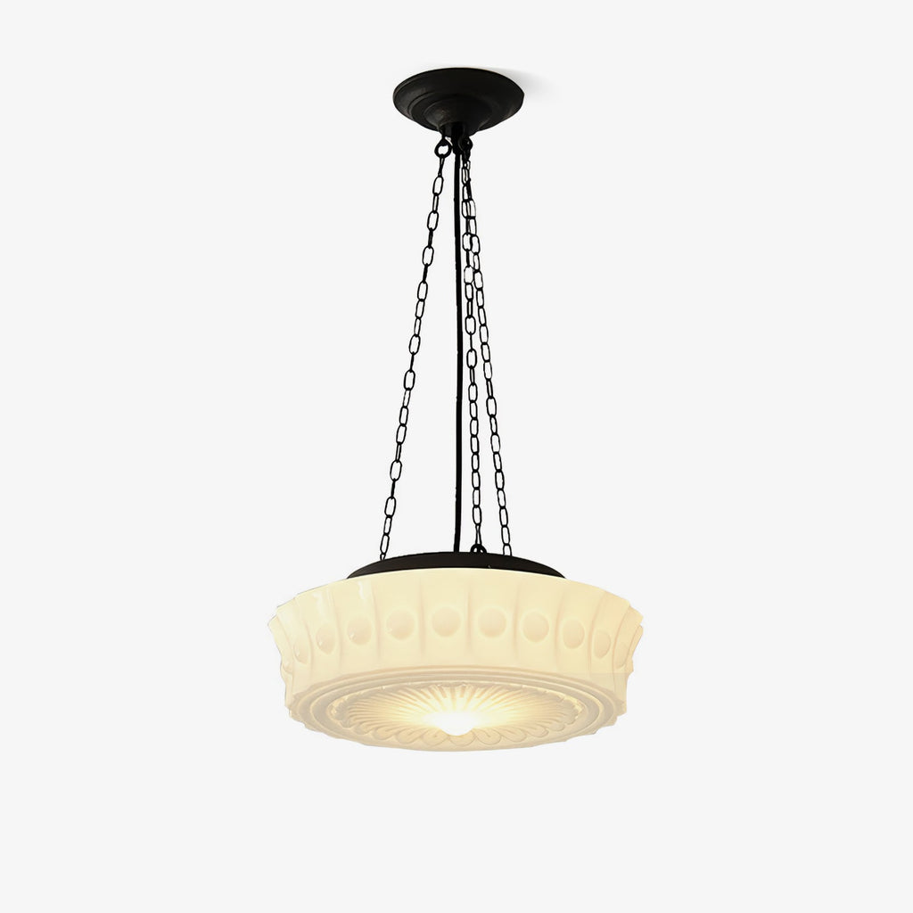 Shown against a plain background, this beige fluted-glass Clérachic pendant's ribbed shade glows softly beneath three black chains.