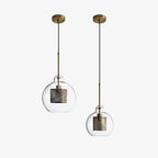 Cluster of glass pendant lights glowing warmly in an interior