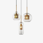 Glass pendant light with warm glow shown against a clean wall