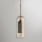Blown glass pendant light glowing softly against a neutral wall