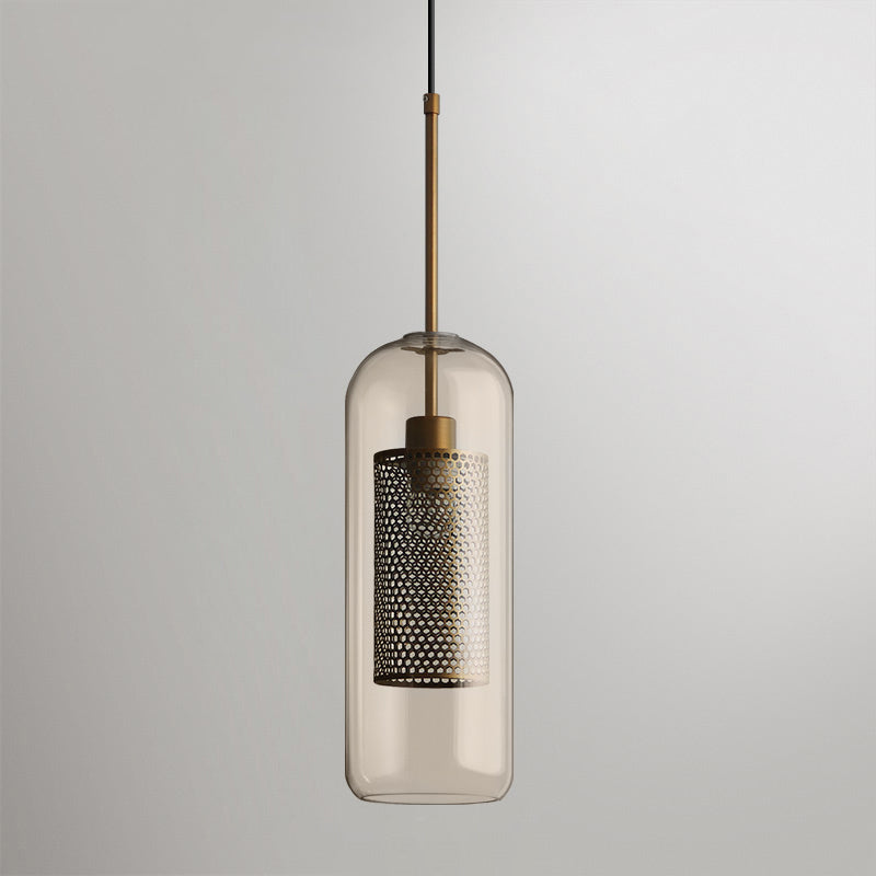 Blown glass pendant light glowing softly against a neutral wall