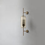 Glass globe wall light glowing warmly against a neutral wall