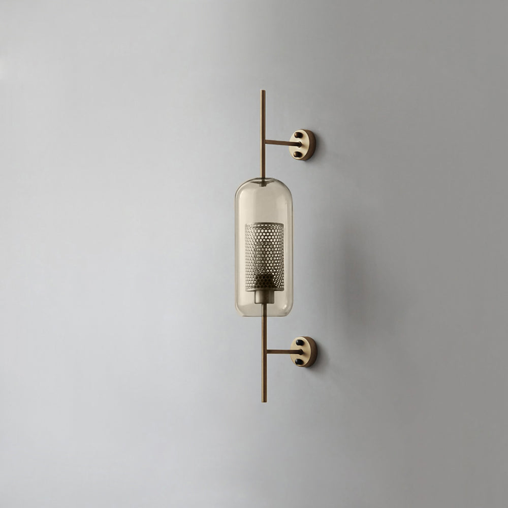 Glass globe wall light glowing warmly against a neutral wall