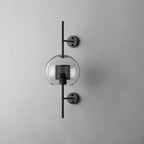 Hand-cut glass wall light with warm glow in a cosy interior