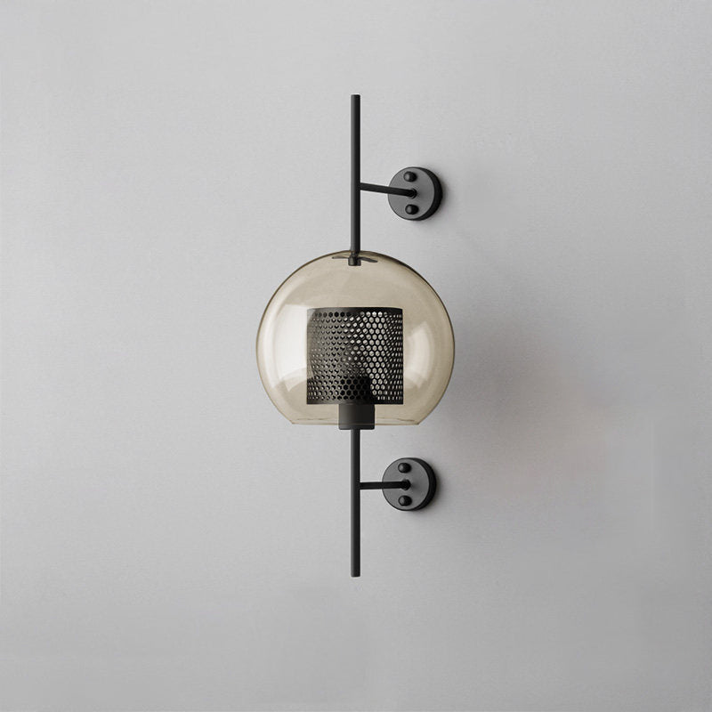 Glass globe wall light glowing gently in a modern interior