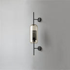 Glass wall light with warm glow mounted beside an interior wall