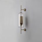 Glass globe wall light glowing gently in a styled interior