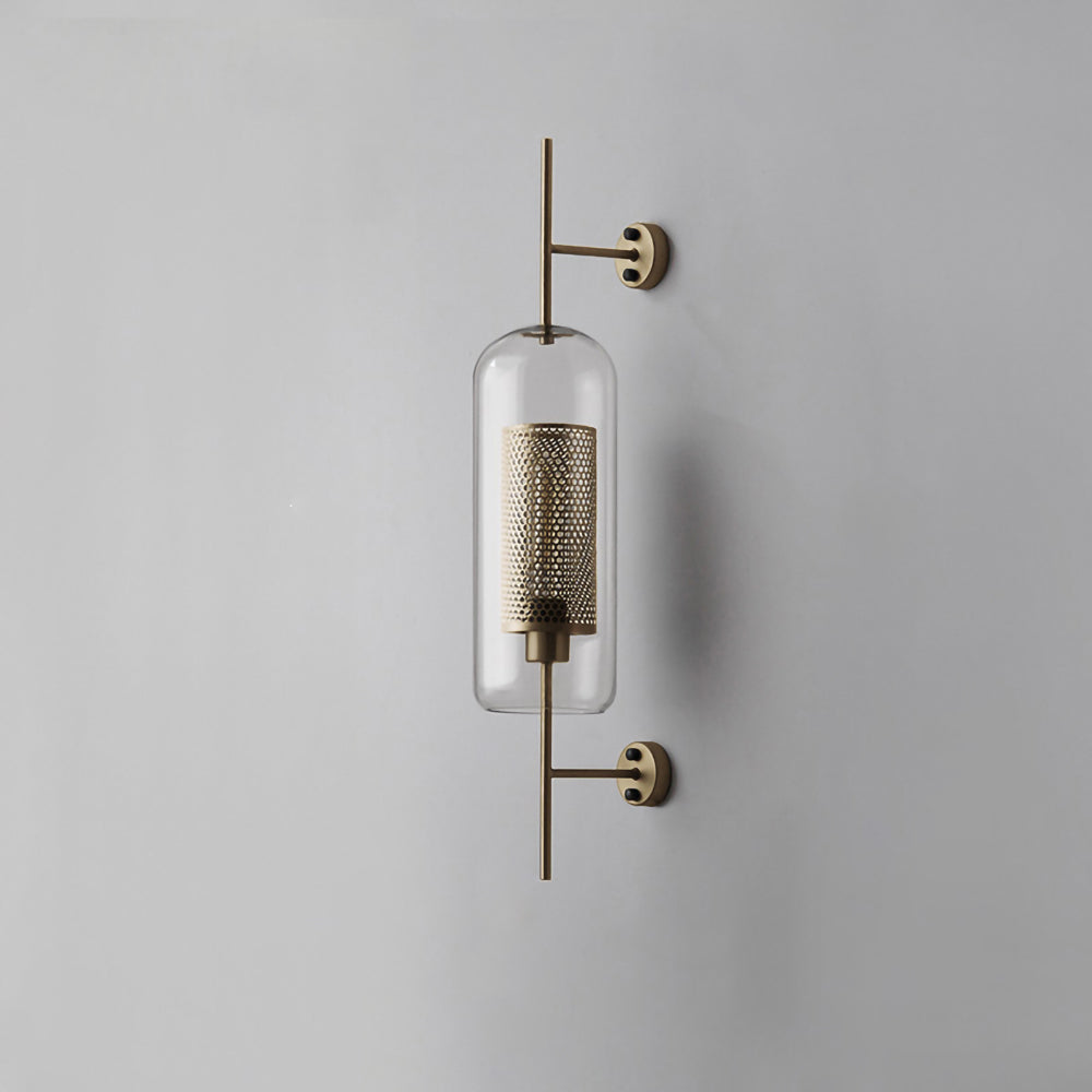 Glass globe wall light glowing gently in a styled interior