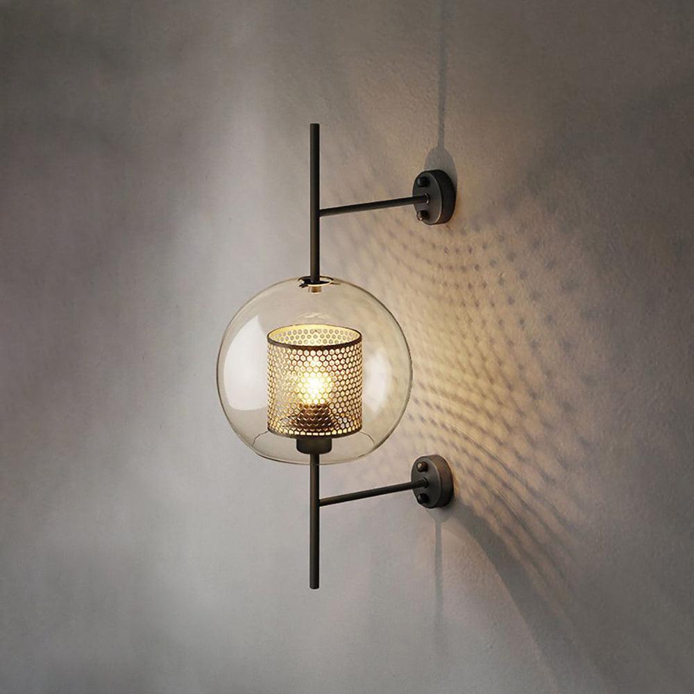 Capsule glass wall light in black finish with clear glass shade
