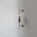 Capsule glass wall light in copper finish with clear glass shade
