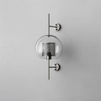 Sphere glass wall light in silver, larger size, with clear shade