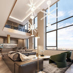 This Clérachic pendant hangs lit high above a living room sofa, seen through floor-to-ceiling windows.