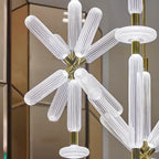 Close view of this Clérachic pendant's ribbed crystal rods meeting at a champagne-gold joint.