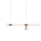 Two slim Clérachic pendants with fluted glass cylinders hang side by side on bare cords.