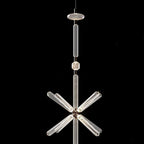 Below a fluted rod, this Clérachic pendant's crystal arms burst outward against black.