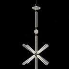 A round disc cap joins a fluted rod to a crystal burst on this Clérachic pendant.