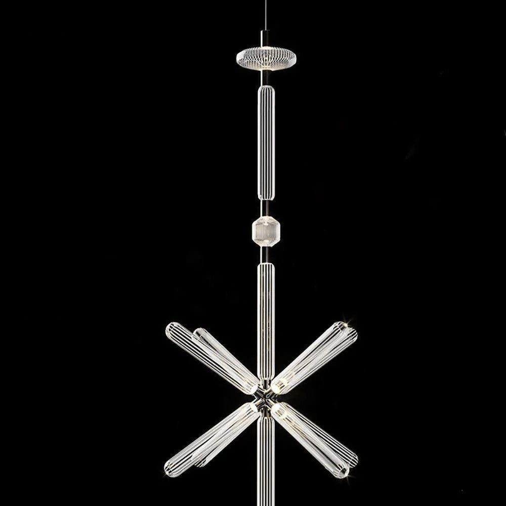 A round disc cap joins a fluted rod to a crystal burst on this Clérachic pendant.