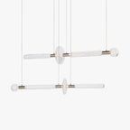 Two horizontal Clérachic pendants with fluted glass rods and round discs, shown lit on a plain white backdrop.
