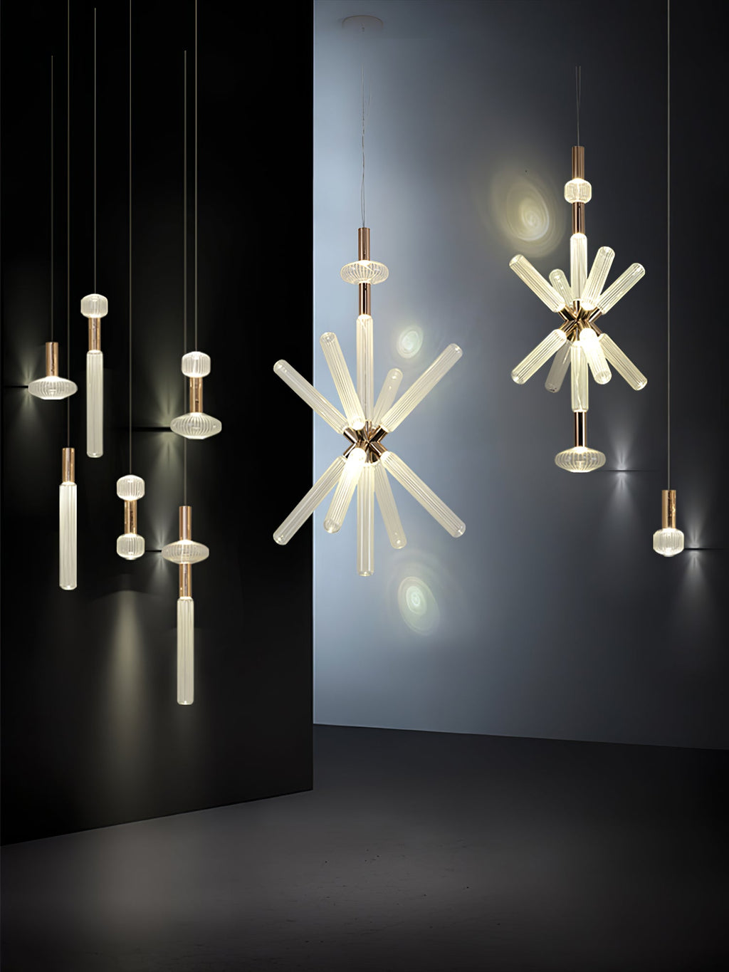 A cluster of Clérachic pendants, from single rods to full crystal bursts, lit against a black backdrop.