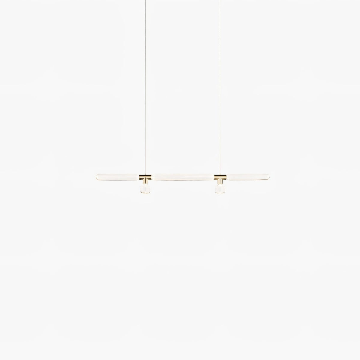 Faint and lit, this Clérachic pendant's slim bar glows softly on a white backdrop.