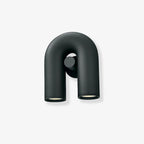 Front view of this Clérachic wall light in black, unlit, against a plain light-grey backdrop.