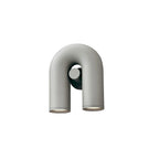 This grey Clérachic wall light stands front-on and unlit against a plain white backdrop.