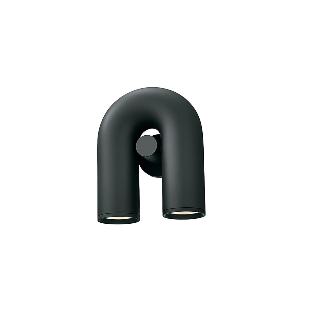 Three-quarter view of this black Clérachic wall light, unlit, against a plain backdrop.