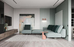 Barely visible on a living room wall, a small terracotta Clérachic wall light sits near framed art above the sofa.