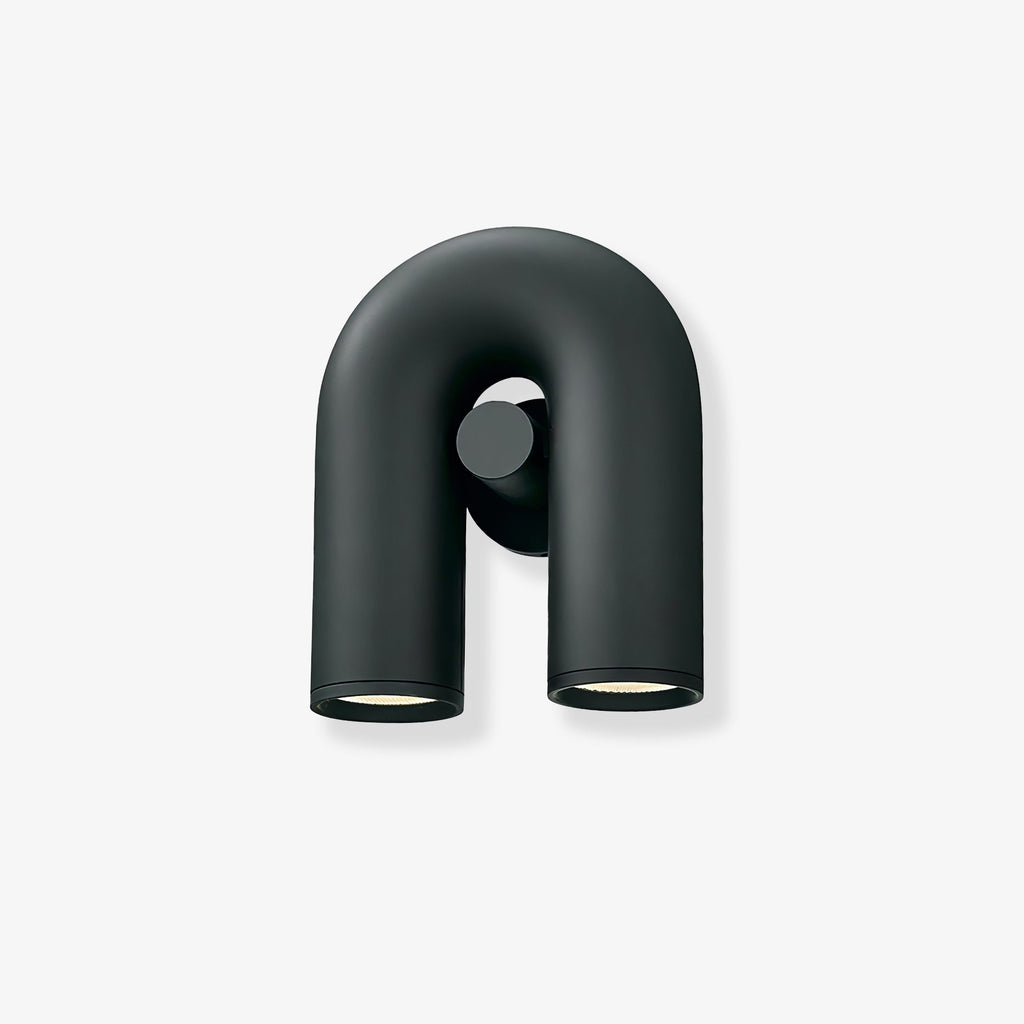 Front view of this Clérachic wall light in black, unlit, showing the U-shaped tube and swivel spotlight heads against a plain backdrop.
