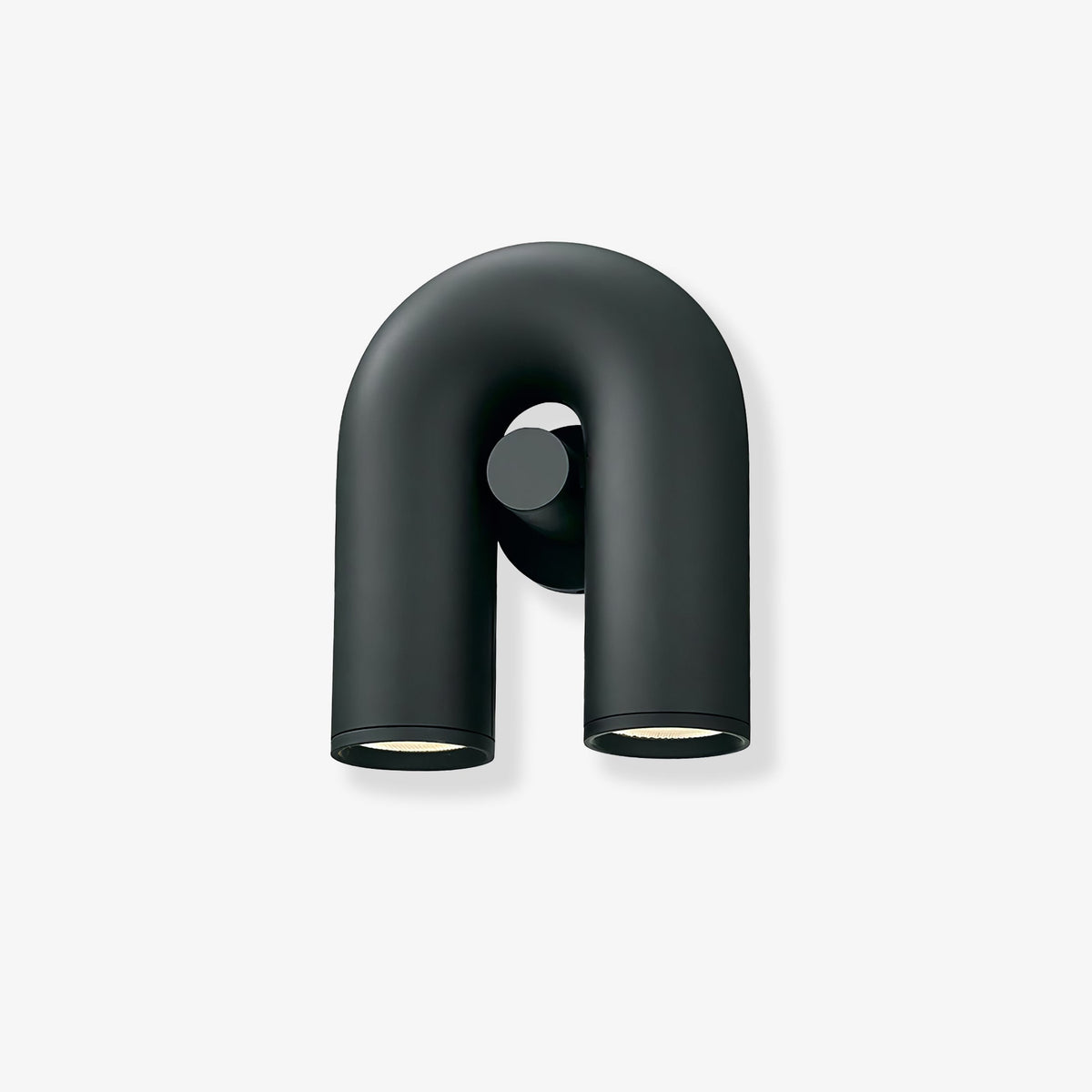 Front view of this Clérachic wall light in black, unlit, showing the U-shaped tube and swivel spotlight heads against a plain backdrop.