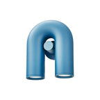 Angled view of this blue Clérachic wall light, unlit, against a plain backdrop.
