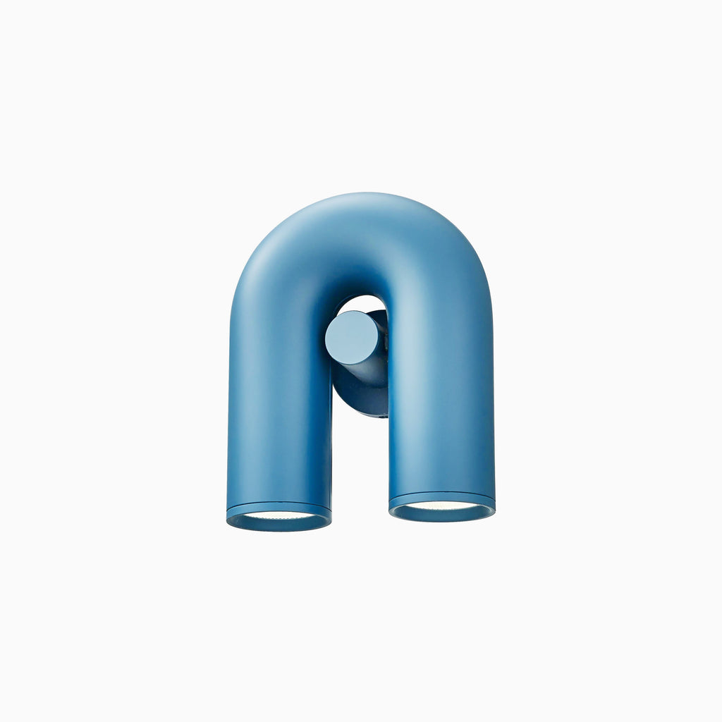 Small centred view of this blue Clérachic wall light, unlit, on a plain backdrop.