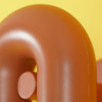Close-up of the curved top and swivel knob on this terracotta Clérachic wall light, against yellow.