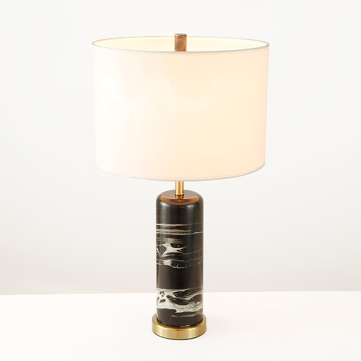 The Clérachic table lamp is shown on white with its brass neck ring visible just beneath the fabric shade.