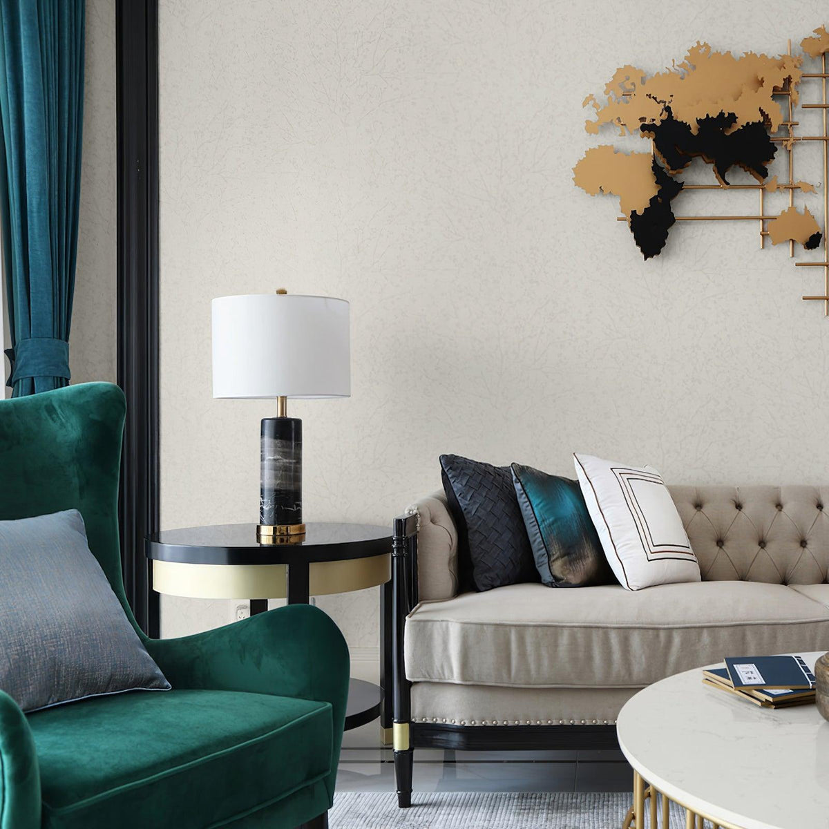 The Clérachic table lamp stands on a round side table beside a green velvet armchair and wall sculpture.
