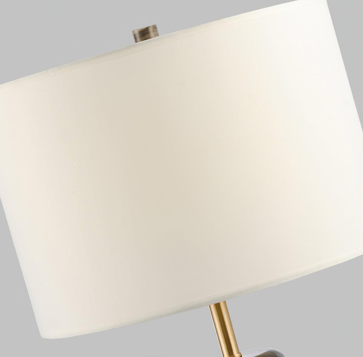 A low upward angle on the Clérachic table lamp's shade interior, with the brass finial visible at its centre.
