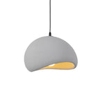 Soft sphere cloud pendant light suspended over a dining area