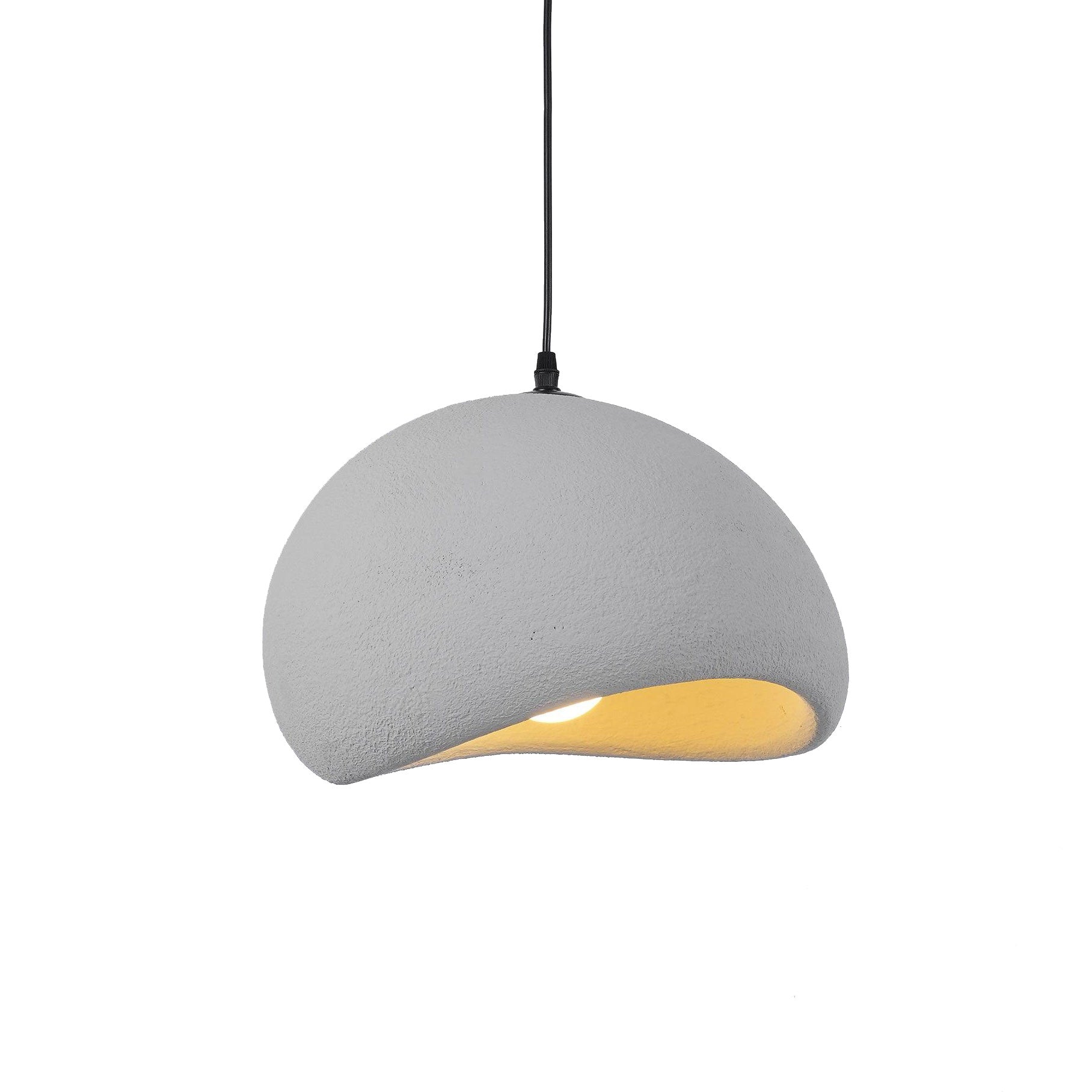 Soft sphere cloud pendant light suspended over a dining area